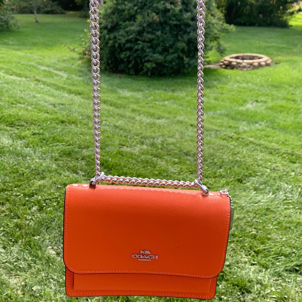 Bright orange coach bag L-7in H-4in W-1/12 in